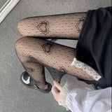 Fishnet tights with heart detail