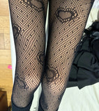 Fishnet tights with heart detail