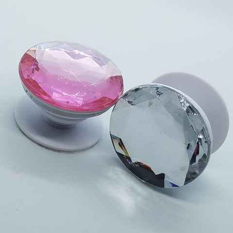 Plastic jewel pop up stand and grip