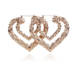 Gia Monet Large bamboo earrings gold and rose gold colors double heart hoop